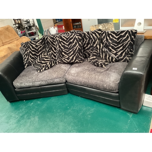 104 - Leather and cloth 2 seat v shape sofa