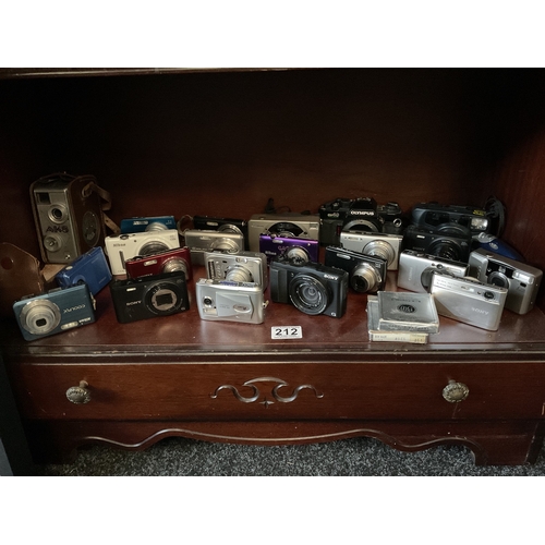 212 - Shelf assorted digital cameras