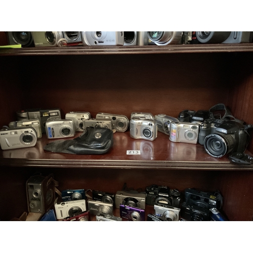 213 - Shelf assorted digital cameras