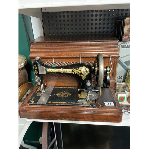 23 - Cased vintage singer sewing machine