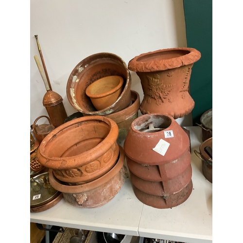 28 - Assortment of terracotta pots including a footed urn