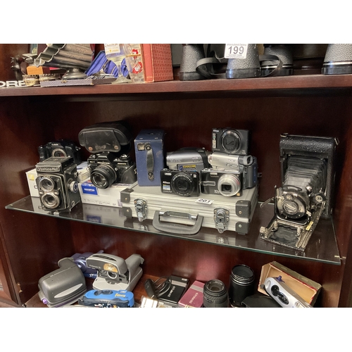 201 - Shelf of assorted cameras