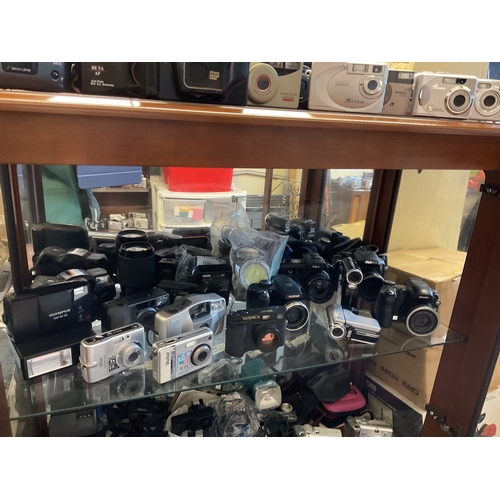 107 - Shelf assorted cameras