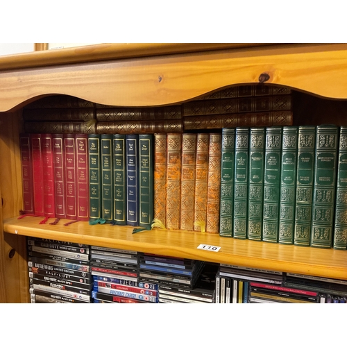 110 - Large qty guild publishing green leather hardback books & Wilbur Smith hardback books etc