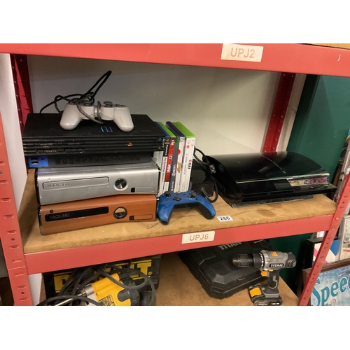 286 - Shelf assorted consoles including ps2, xbox's etc (Untested)