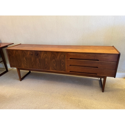 Rare Rosewood Veneer - A Younger La Cliquot Sideboard Designed 1959 - Length: 198.5cm, Depth: 45.5cm, Height: 73cm. Maker: A Younger. Designer: John Herbert. Year: 1959 - 1961. In very good condition and would benefit from an oil and polish.
