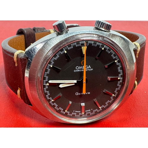1969 Omega Chronostop Genéve Drivers Model 145.010 with Grey Sloped Dial steel  – Grey Dial with Orange Stopwatch Timer Hand – c.1969.

A classic 1960s Omega Chronostop featuring the manual-wind Calibre 865 movement. Originally designed as a driver's watch with a simplified stopwatch function, the Chronostop won the 1967 Honor Prize for "Watchmaking Design."

Features a grey dial, orange central timer stop watch hand, and signed crown.

Light scratches to crystal/case. Overall Excellent Working Condition. Not the Original Strap. Shipping available.  

Keywords:
Omega Chronostop, Genève, vintage Omega, 145.009, Calibre 865, manual wind, 1960s watch, drivers watch, Swiss made, luxury timepiece, orange hand.