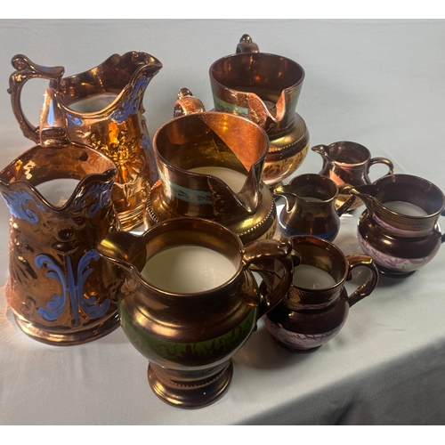 25 - Victorian Lustre Copper Tea Set Teapot Jugs Creamers Cups Assorted  Large lustreware group. Mixed co... 