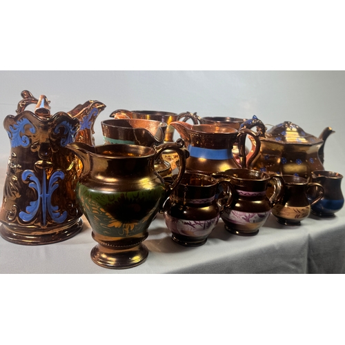 25 - Victorian Lustre Copper Tea Set Teapot Jugs Creamers Cups Assorted  Large lustreware group. Mixed co... 