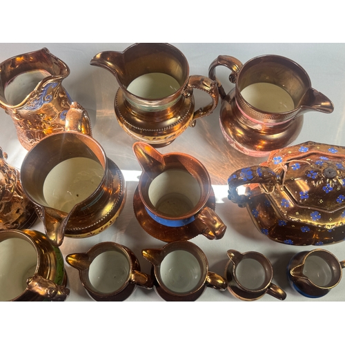 25 - Victorian Lustre Copper Tea Set Teapot Jugs Creamers Cups Assorted  Large lustreware group. Mixed co... 