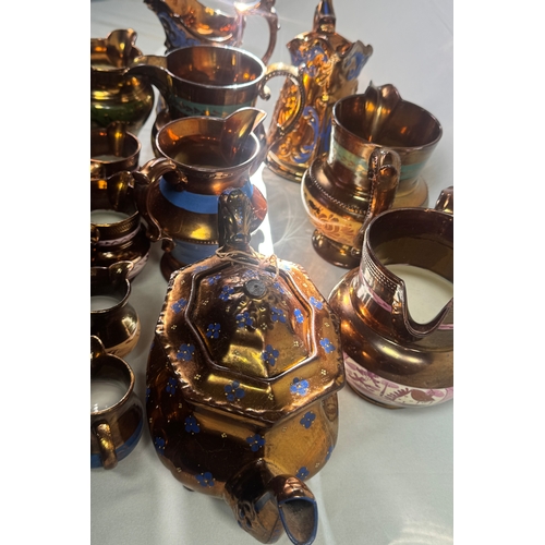 25 - Victorian Lustre Copper Tea Set Teapot Jugs Creamers Cups Assorted  Large lustreware group. Mixed co... 