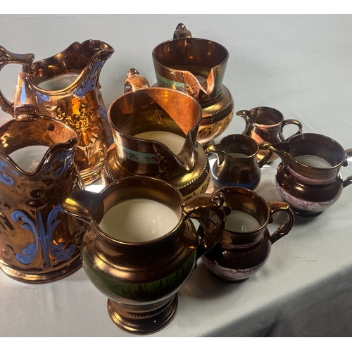 25 - Victorian Lustre Copper Tea Set Teapot Jugs Creamers Cups Assorted  Large lustreware group. Mixed co... 