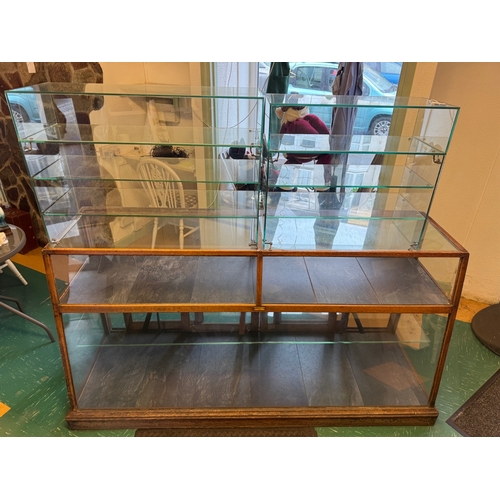 Antique Oak Shop Display Cabinet Glass Counter Sliding Doors Shelves. JWR Swansea Shop Fitters.

Original retail display. Good condition; scratches, wear, some glass marks. Shipping available.

Keywords: Shop Display Cabinet, Oak Counter, Glass Display Case, Retail Cabinet, Antique Shop Fitting, Sliding Doors, Vintage Display.