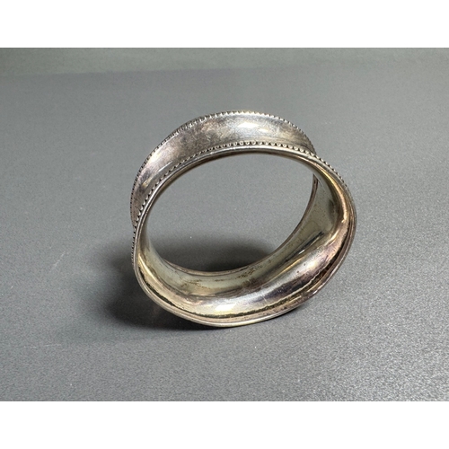 56 - Hallmarked Silver Napkin Ring Beaded Edge Marked Bros  Classic tableware piece. Fair condition; plat... 