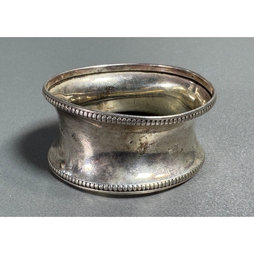 56 - Hallmarked Silver Napkin Ring Beaded Edge Marked Bros  Classic tableware piece. Fair condition; plat... 