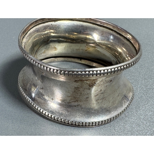 56 - Hallmarked Silver Napkin Ring Beaded Edge Marked Bros  Classic tableware piece. Fair condition; plat... 
