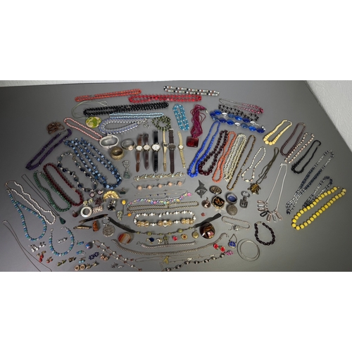 51 - Large mixed vintage jewellery lot — necklaces, brooches, earrings, watches; pair marked 