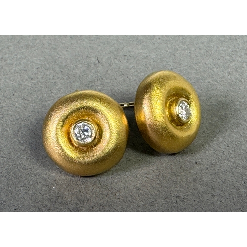50 - 18ct (750) hallmarked gold stud earrings with central brilliant-cut diamonds — 5.65g total.

Hallmar... 