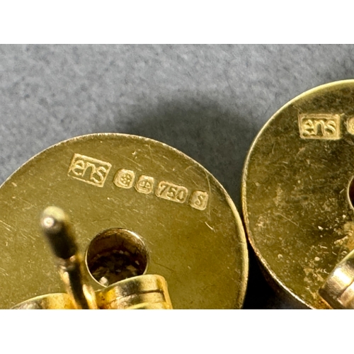 50 - 18ct (750) hallmarked gold stud earrings with central brilliant-cut diamonds — 5.65g total.

Hallmar... 
