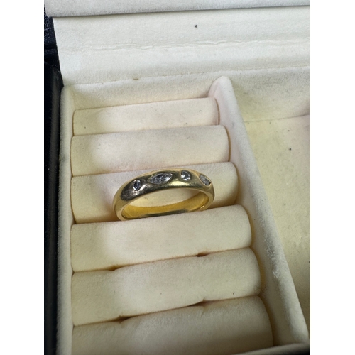 49 - 18ct (750) gold five‑stone diamond band — marquise & round cuts, UK hallmarks, 7.17g.

Fair vintage ... 
