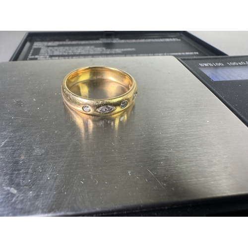 49 - 18ct (750) gold five‑stone diamond band — marquise & round cuts, UK hallmarks, 7.17g.

Fair vintage ... 