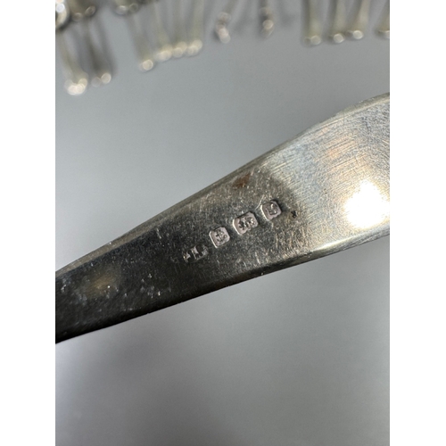 43 - Assorted hallmarked sterling & silver‑plate flatware lot — teaspoons, dessert/serving spoons, sugar ... 