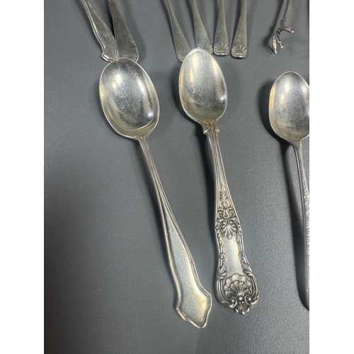 43 - Assorted hallmarked sterling & silver‑plate flatware lot — teaspoons, dessert/serving spoons, sugar ... 