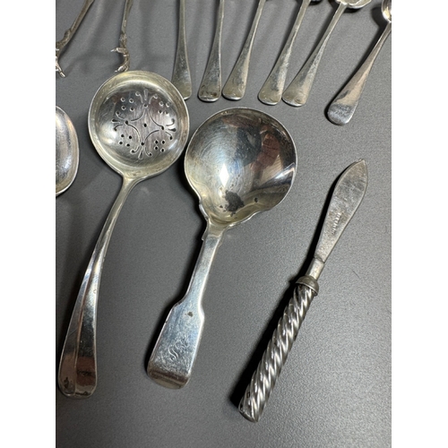 43 - Assorted hallmarked sterling & silver‑plate flatware lot — teaspoons, dessert/serving spoons, sugar ... 