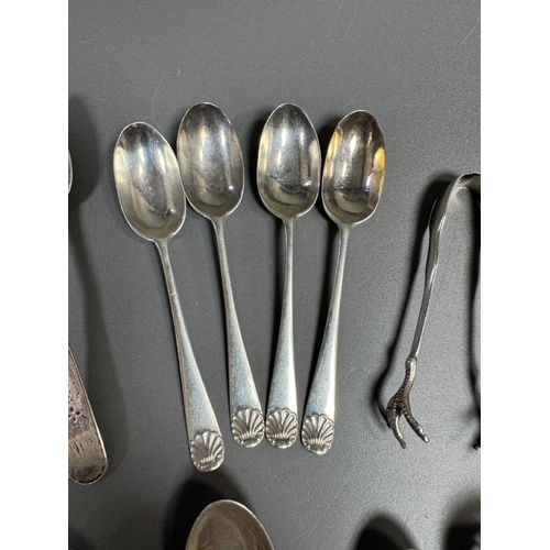 43 - Assorted hallmarked sterling & silver‑plate flatware lot — teaspoons, dessert/serving spoons, sugar ... 