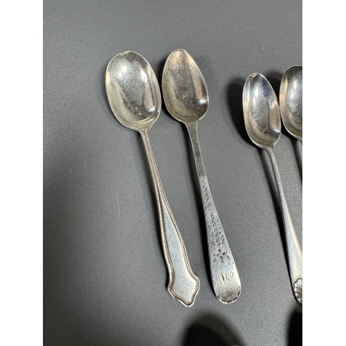 43 - Assorted hallmarked sterling & silver‑plate flatware lot — teaspoons, dessert/serving spoons, sugar ... 