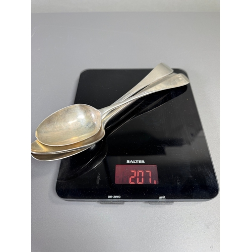 42 - English hallmarked sterling tablespoons — three large spoons, 207g total, assorted makers & date let... 