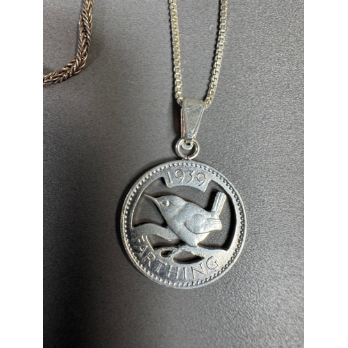 34 - Mixed silver lot — three coin‑charm bangles, cut 1939 farthing pendant on chain and assorted silver ... 