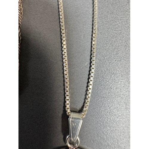 34 - Mixed silver lot — three coin‑charm bangles, cut 1939 farthing pendant on chain and assorted silver ... 