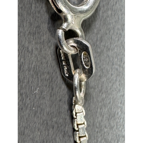 34 - Mixed silver lot — three coin‑charm bangles, cut 1939 farthing pendant on chain and assorted silver ... 