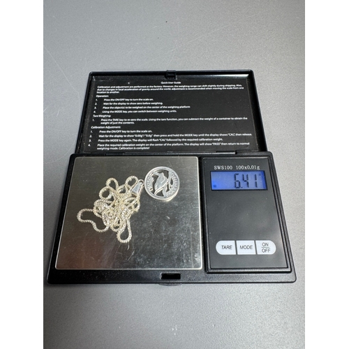 34 - Mixed silver lot — three coin‑charm bangles, cut 1939 farthing pendant on chain and assorted silver ... 