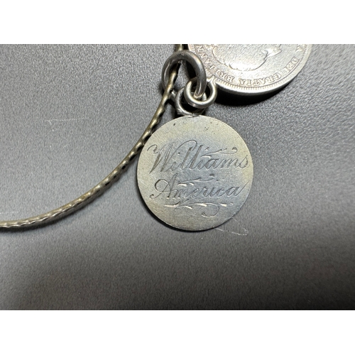 34 - Mixed silver lot — three coin‑charm bangles, cut 1939 farthing pendant on chain and assorted silver ... 