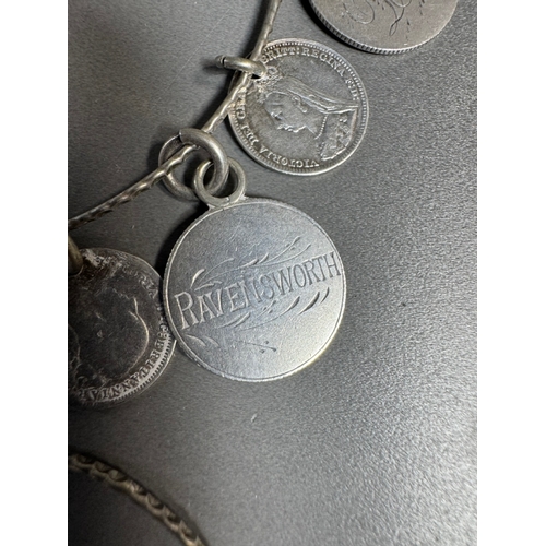 34 - Mixed silver lot — three coin‑charm bangles, cut 1939 farthing pendant on chain and assorted silver ... 