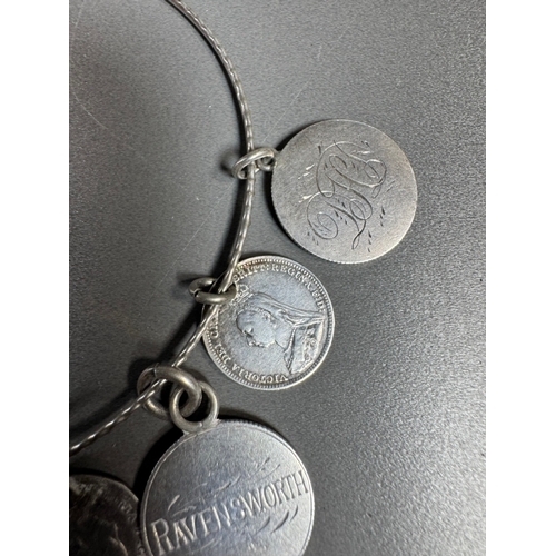 34 - Mixed silver lot — three coin‑charm bangles, cut 1939 farthing pendant on chain and assorted silver ... 