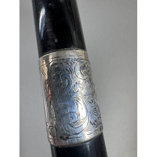 28 - Ebonised walking cane with engraved silver collar & cap, brass ferrule — approx. 95cm.

Ebonised can... 