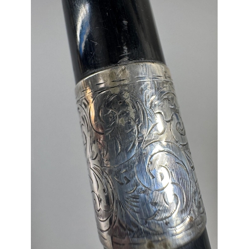 28 - Ebonised walking cane with engraved silver collar & cap, brass ferrule — approx. 95cm.

Ebonised can... 