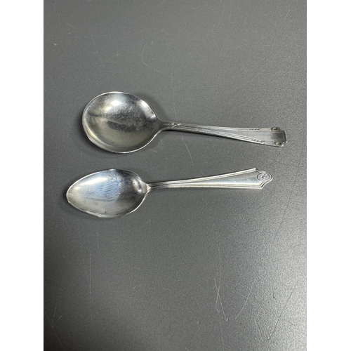 27 - English hallmarked sterling tea spoon & small cream soup spoon — decorative handles (combined weight... 