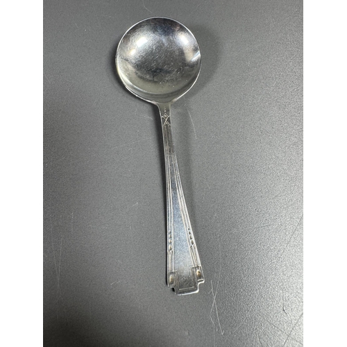 27 - English hallmarked sterling tea spoon & small cream soup spoon — decorative handles (combined weight... 