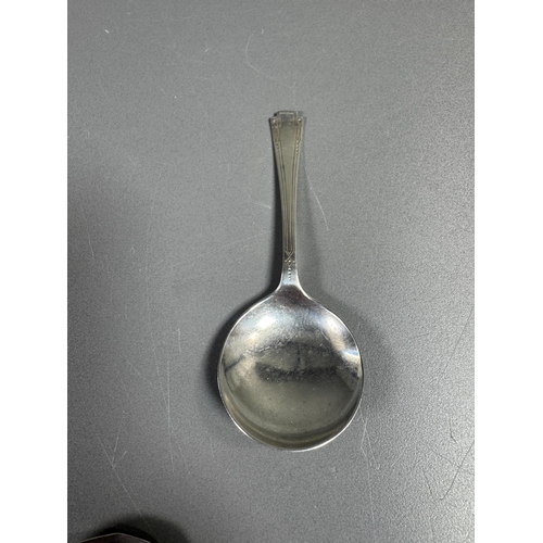 27 - English hallmarked sterling tea spoon & small cream soup spoon — decorative handles (combined weight... 
