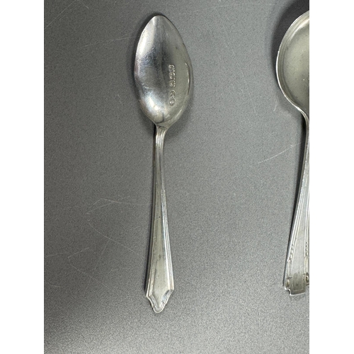 27 - English hallmarked sterling tea spoon & small cream soup spoon — decorative handles (combined weight... 