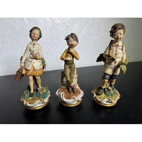 585 - Set of 3 Italian Figurines – Hand‑Painted Capodimonte‑Style Children (Shipping Available).

Charming... 