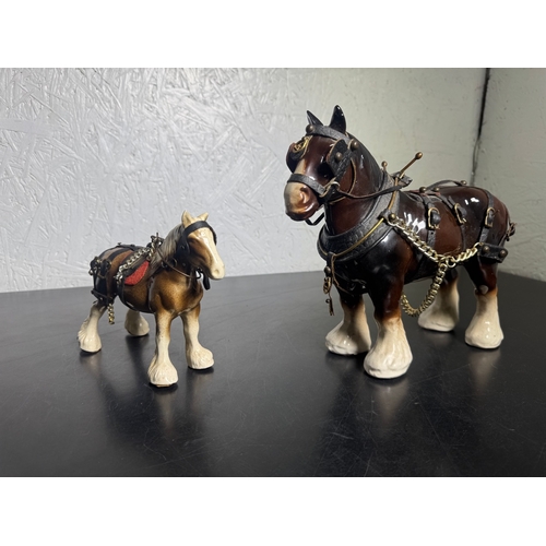 595 - Pair of Beswick-Style Shire Horses with Full Harness (Shipping Available).

A charming pair of ceram... 