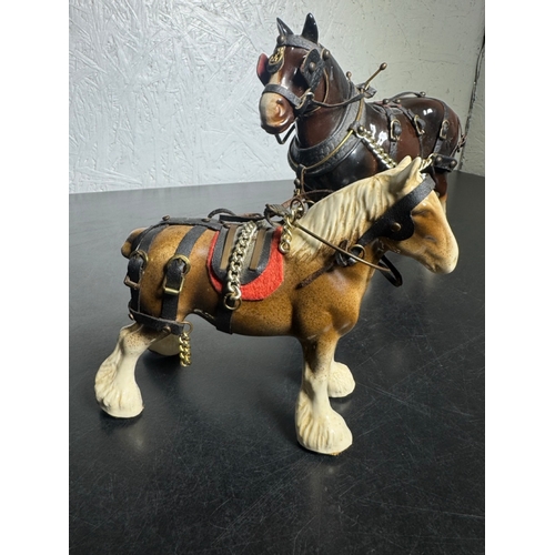 595 - Pair of Beswick-Style Shire Horses with Full Harness (Shipping Available).

A charming pair of ceram... 