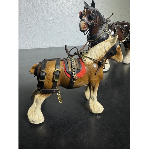 595 - Pair of Beswick-Style Shire Horses with Full Harness (Shipping Available).

A charming pair of ceram... 