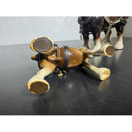 595 - Pair of Beswick-Style Shire Horses with Full Harness (Shipping Available).

A charming pair of ceram... 