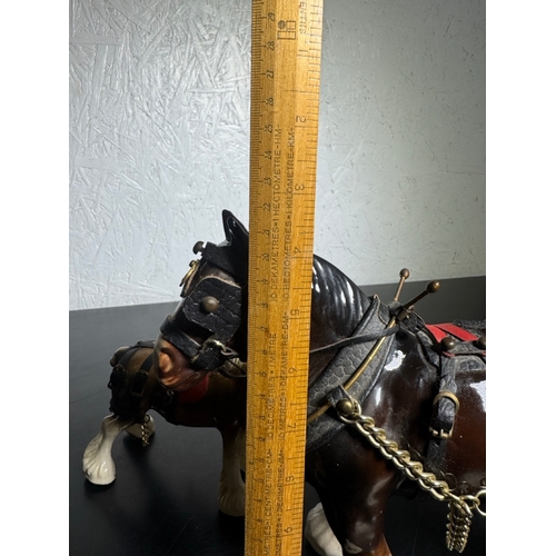 595 - Pair of Beswick-Style Shire Horses with Full Harness (Shipping Available).

A charming pair of ceram... 